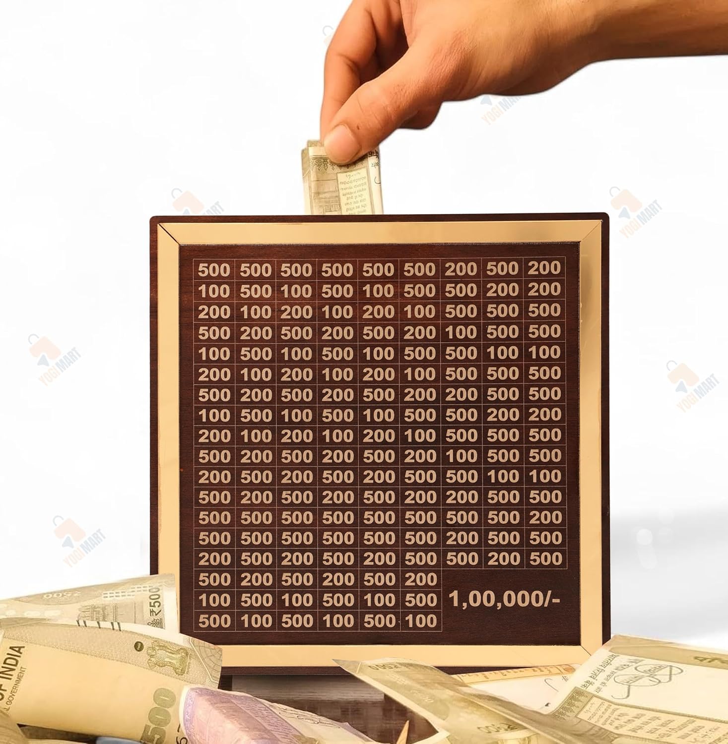 Hand inserting money into a wooden board with numbers, surrounded by Indian currency.